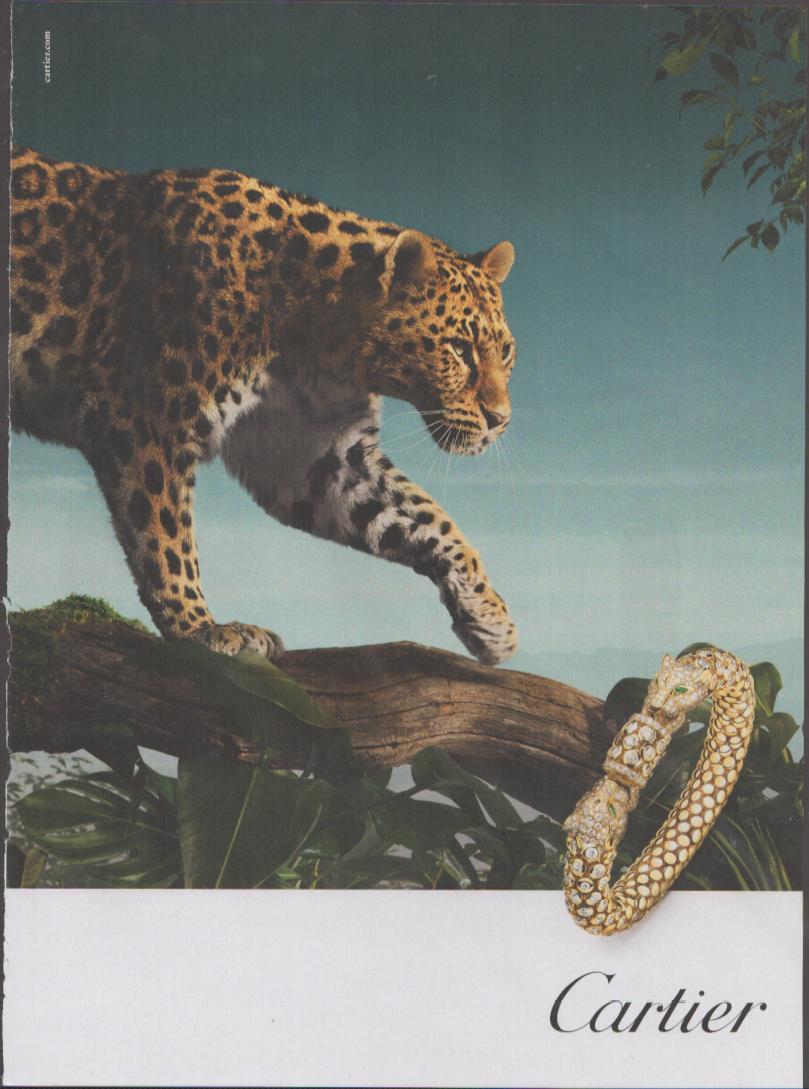 Vintage 1990s Cartier Panthère original print advertisement, leopard on jungle branch with diamond and gold Panthère bracelet