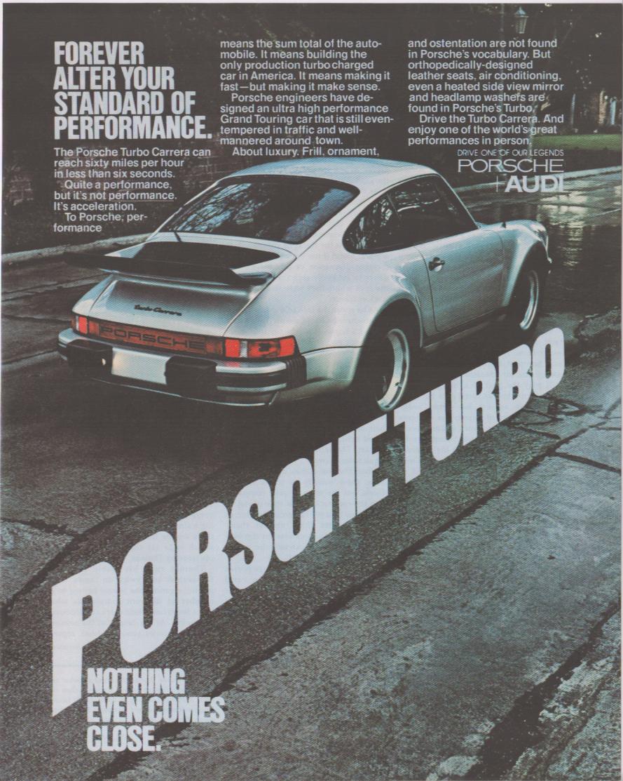 Vintage 1976 Porsche 911 Turbo Carrera original print advertisement, silver 930 Turbo rear three-quarter view on rain-slicked street with bold Porsche Turbo typography