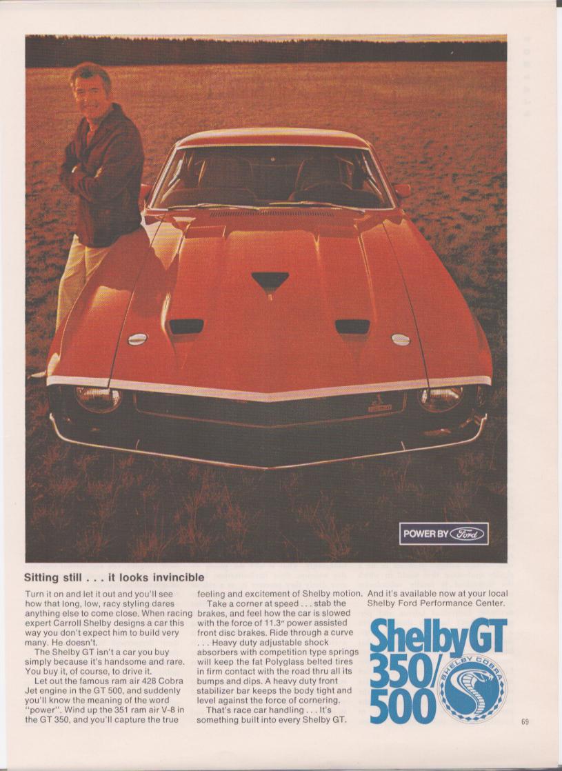 Vintage 1969 Shelby GT 350/500 original print advertisement, Carroll Shelby standing behind red Shelby GT muscle car in open field
