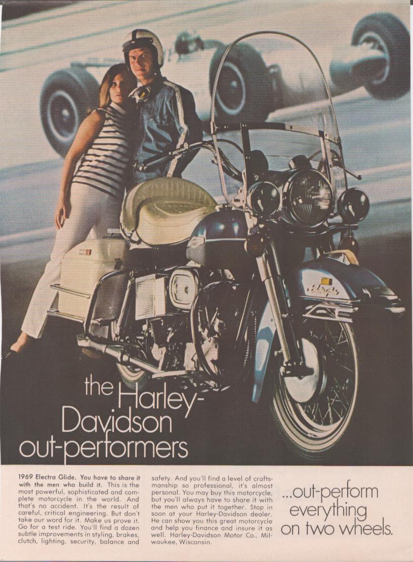 Vintage 1969 Harley-Davidson Electra Glide original print advertisement, couple posing with full-dressed motorcycle against racing background with tagline 'out-perform everything on two wheels'
