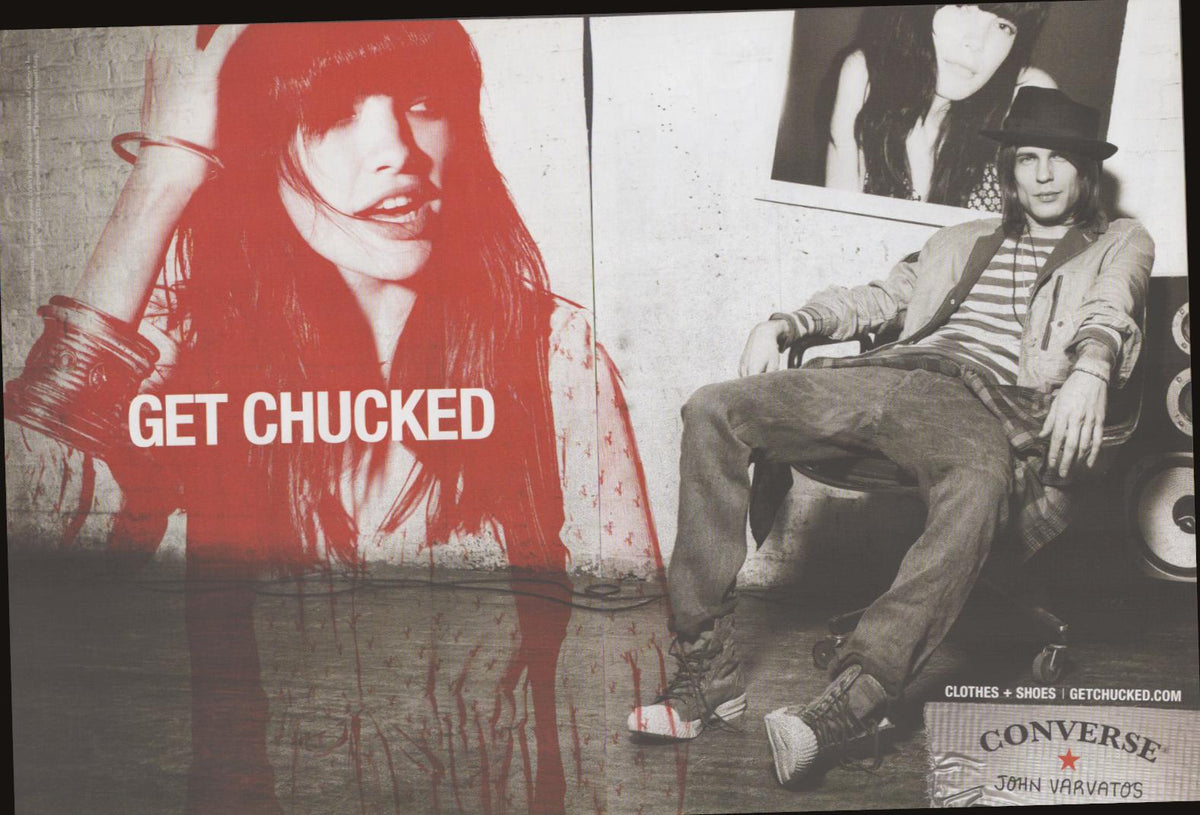 Vintage 2000s Converse John Varvatos original print advertisement, bold red-tinted woman with 'Get Chucked' text alongside black-and-white male model in Chuck Taylor sneakers