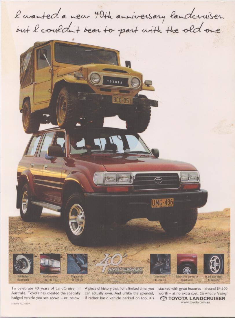 Vintage 1990s Toyota Land Cruiser 40th Anniversary original print advertisement, classic yellow FJ40 stacked on top of a red 80 Series Land Cruiser in outdoor desert setting