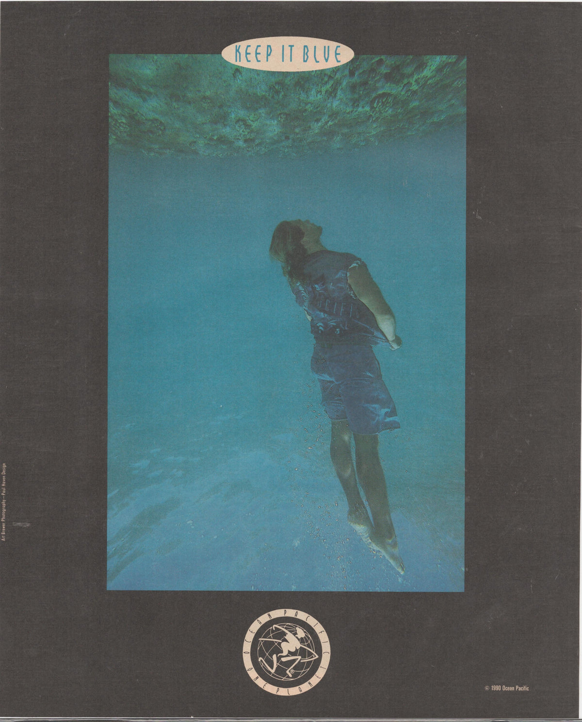 Vintage 1980 Ocean Pacific 'Keep It Blue' original print advertisement, underwater photograph of figure floating in blue water with OP globe logo