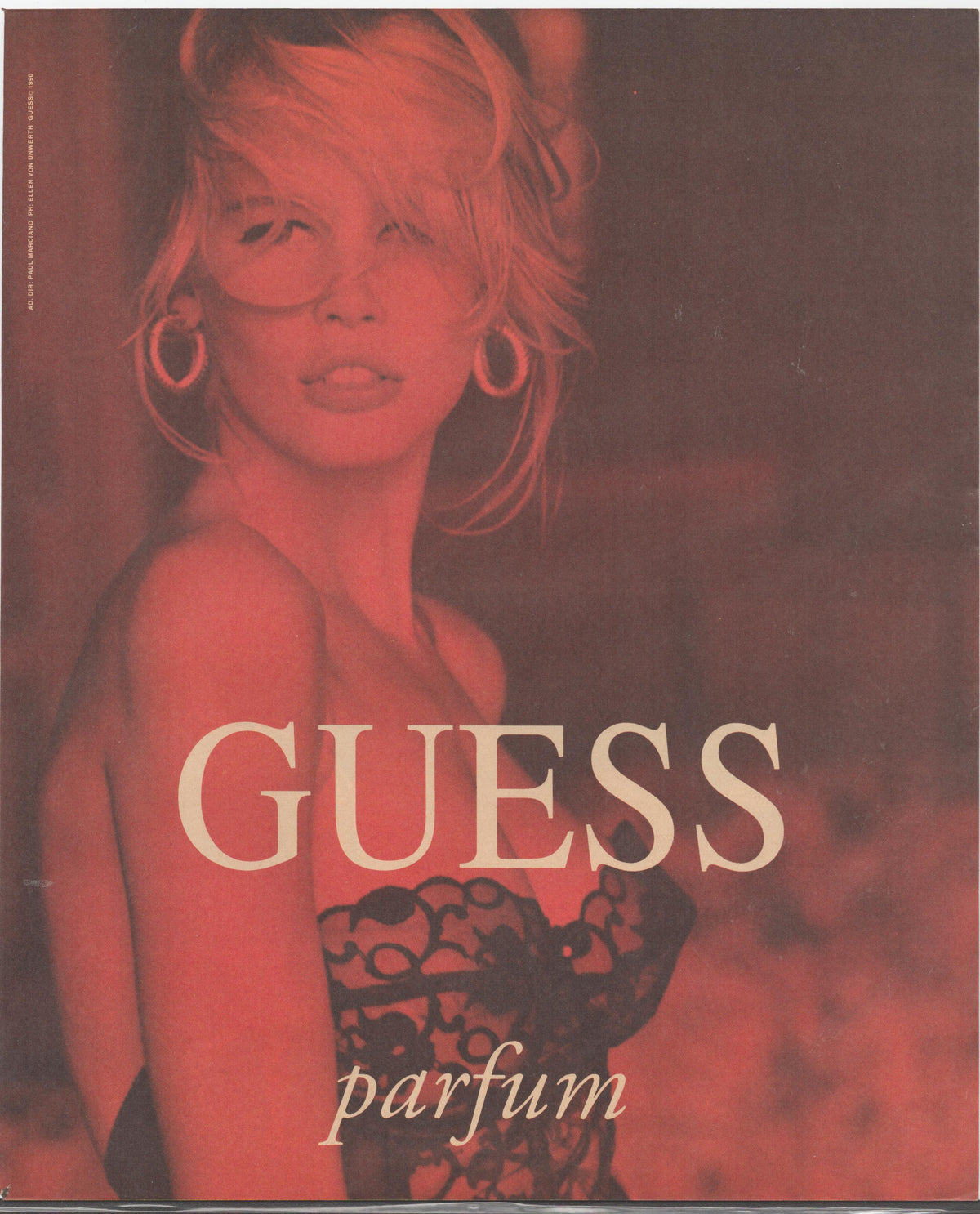 Vintage 1993 Guess Parfum original print advertisement featuring Claudia Schiffer in red-toned fashion photography wearing lace and hoop earrings