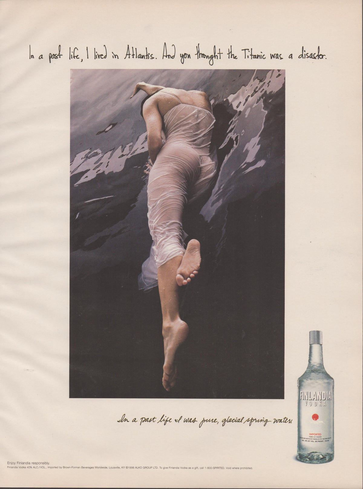 Vintage 1998 Finlandia Vodka original print advertisement, woman in white fabric floating underwater with Atlantis headline and bottle