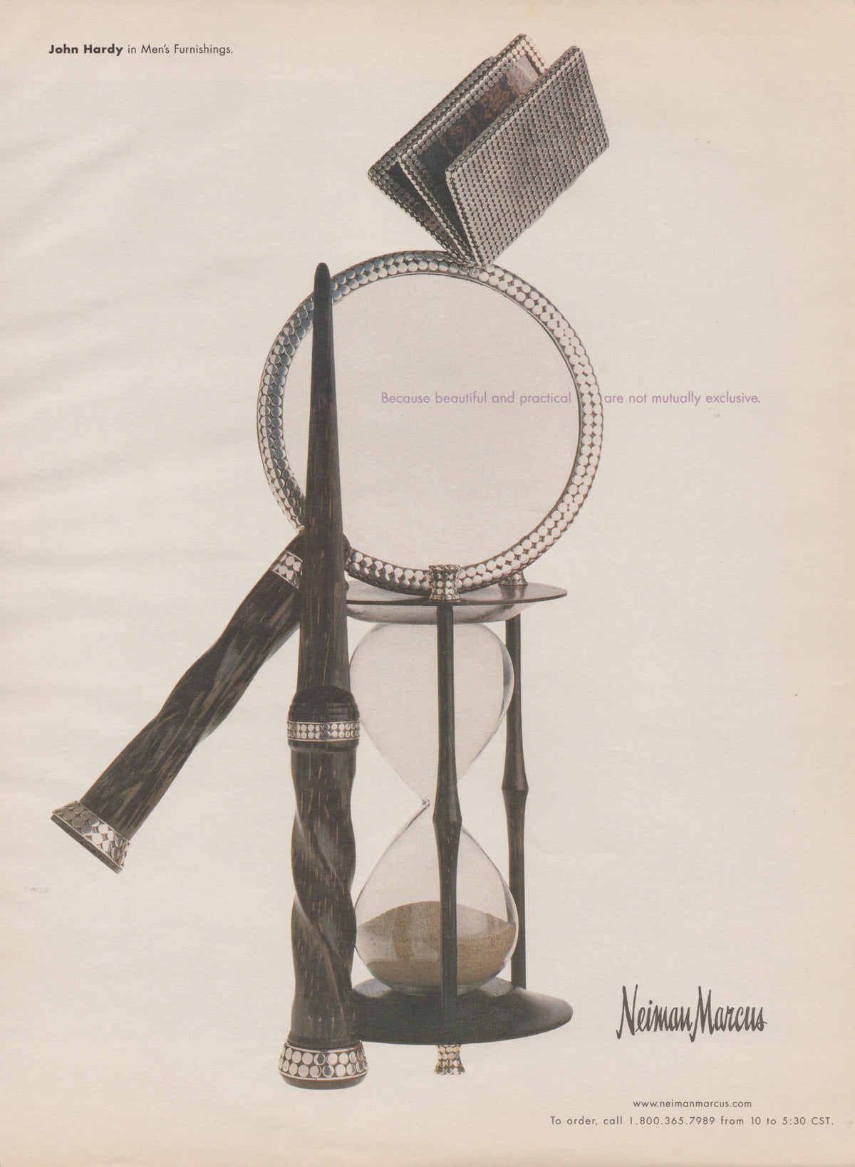 Vintage 1990s John Hardy Men's Furnishings Neiman Marcus original print advertisement, artisan silver wallet, mirror, hourglass and pen arranged in elegant still-life composition on cream background