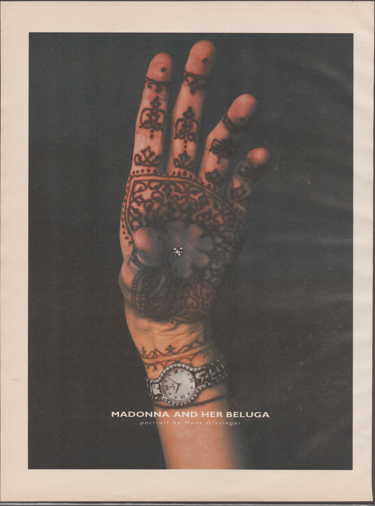 Vintage 1998 Ebel Beluga original print advertisement, Madonna's henna-tattooed hand raised against dark background with diamond watch at wrist, portrait by Hans Gissinger