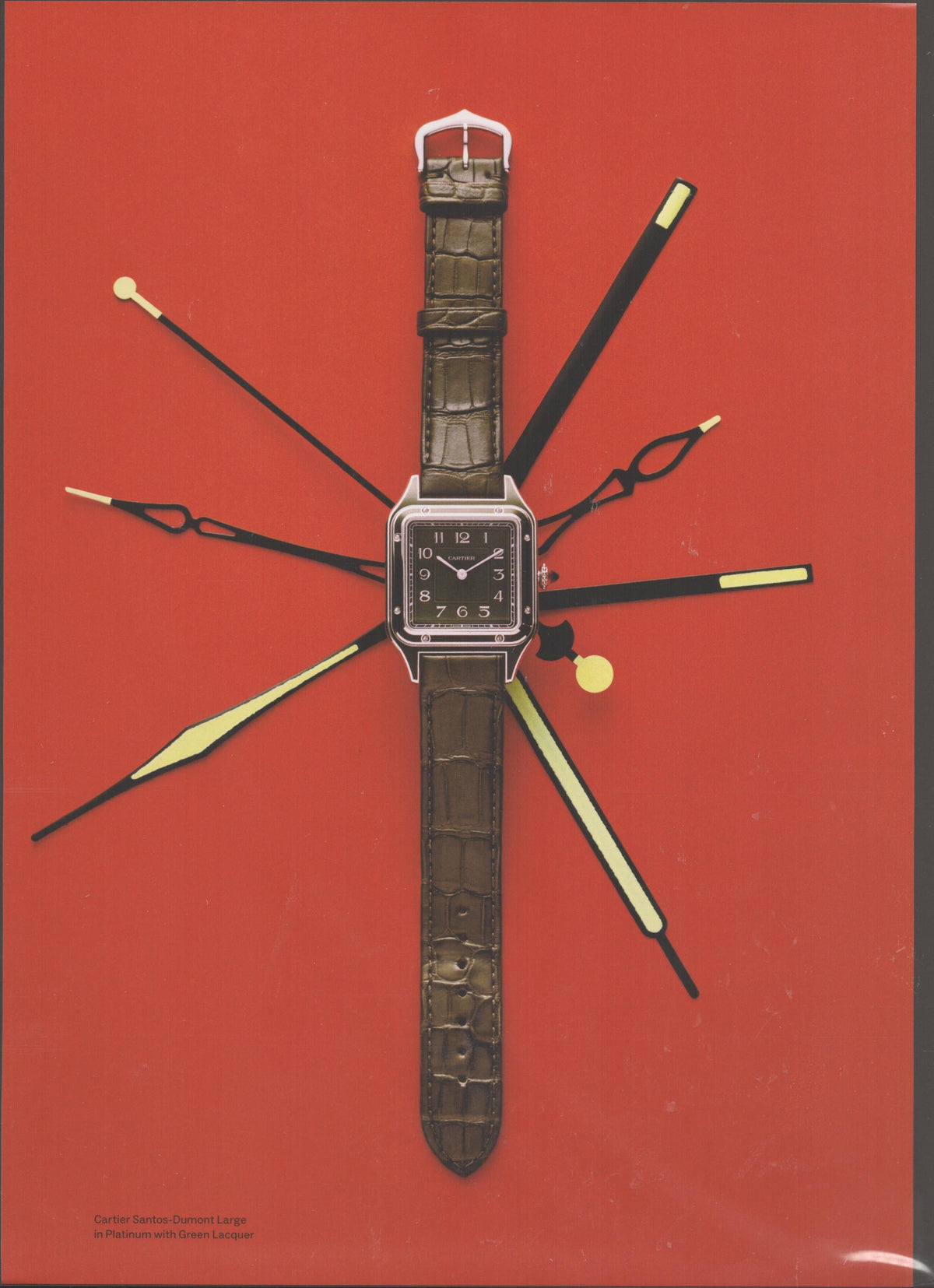 Vintage 2000s Cartier Santos-Dumont Large original print advertisement, platinum square watch with green lacquer dial on olive alligator strap against bold red background with radiating clock hands