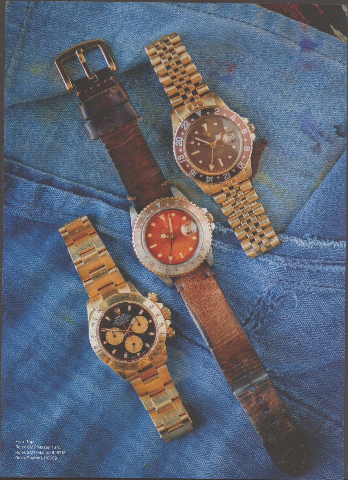 Vintage 1990s Rolex GMT-Master and Daytona original print advertisement, three gold Rolex watches displayed on denim fabric including GMT-Master 1675, GMT-Master II 16713, and Daytona 116508