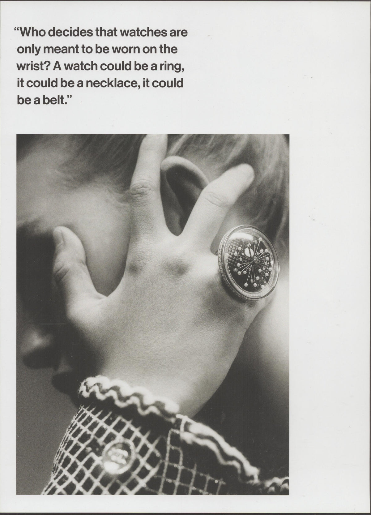 Vintage 1968 Omega ring watch original print advertisement, black and white close-up of ornate circular watch worn as a finger ring against a child's face with quilted sleeve visible
