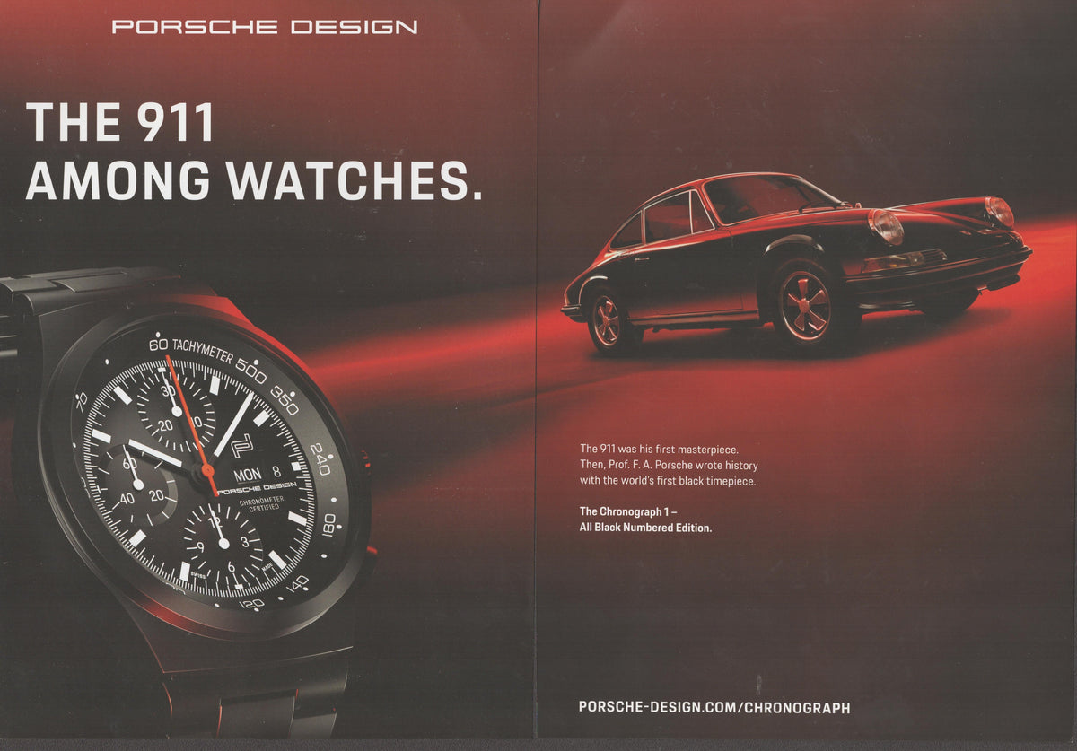 Vintage Porsche Design Chronograph 1 All Black Numbered Edition original print advertisement, dramatic red-lit Porsche 911 coupe beside oversized black chronograph watch face on dark background