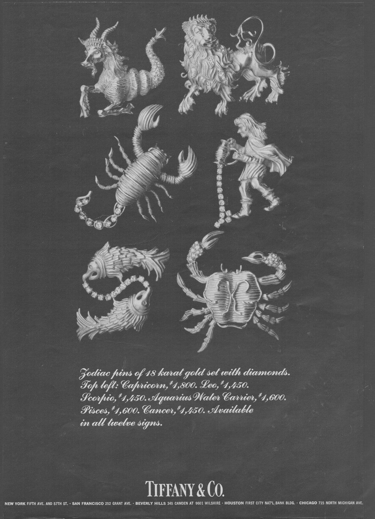 Vintage 1970s Tiffany & Co. Zodiac Diamond Gold Pins original print advertisement, six sculptural 18-karat gold zodiac brooches photographed on dark background with diamond accents
