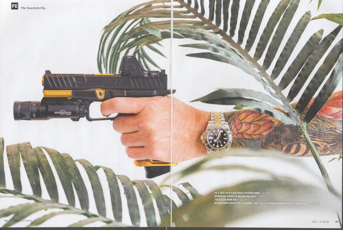 Vintage 2026 Rolex GMT-Master II Zombie Ref. 126773 original print advertisement, tattooed arm holding ZEV OZ9 tactical pistol with Rolex two-tone watch visible on wrist, tropical leaf background