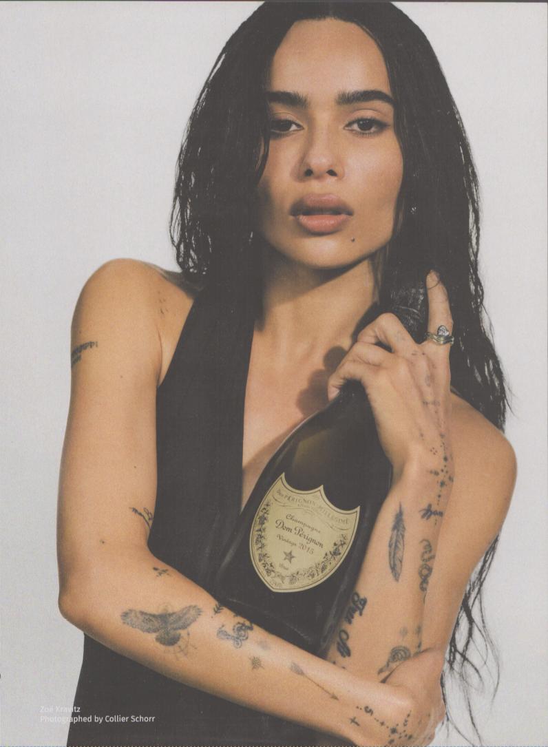 Vintage 2015 Dom Pérignon original print advertisement, Zoë Kravitz holding champagne bottle against white background, photographed by Collier Schorr