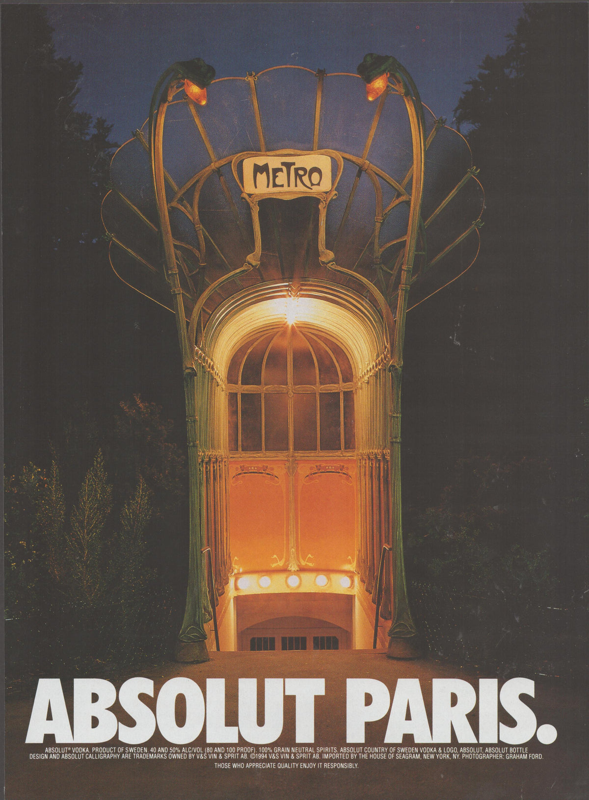 Vintage 1994 Absolut Paris Vodka original print advertisement, illuminated Art Nouveau Paris Metro entrance glowing at night with bold Absolut Paris headline