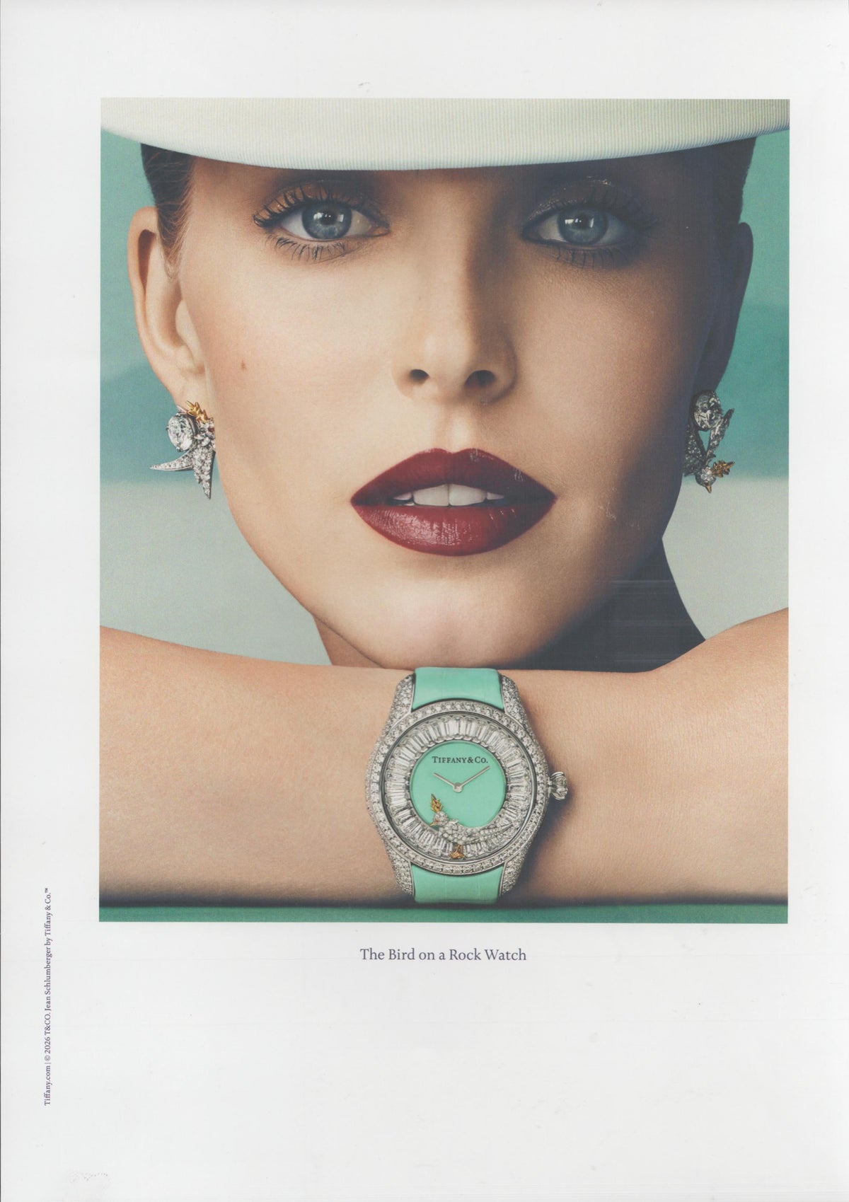 Vintage 2020 Tiffany & Co. Bird on a Rock Watch original print advertisement, close-up model wearing Schlumberger bird earrings with diamond-set watch on Tiffany Blue strap