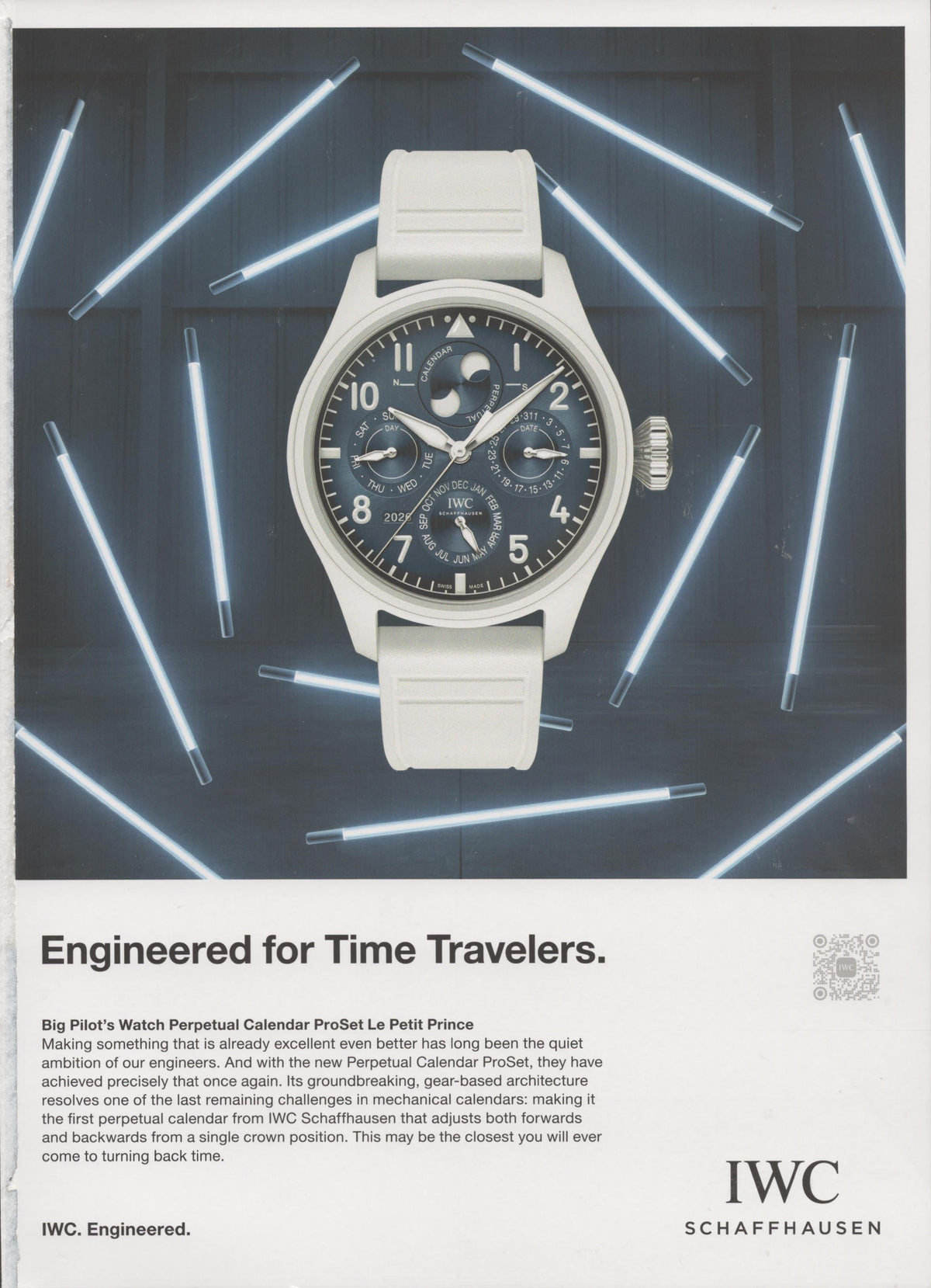 Vintage 2020 IWC Big Pilot's Watch Perpetual Calendar ProSet Le Petit Prince original print advertisement, white ceramic watch on dark background surrounded by glowing neon rods