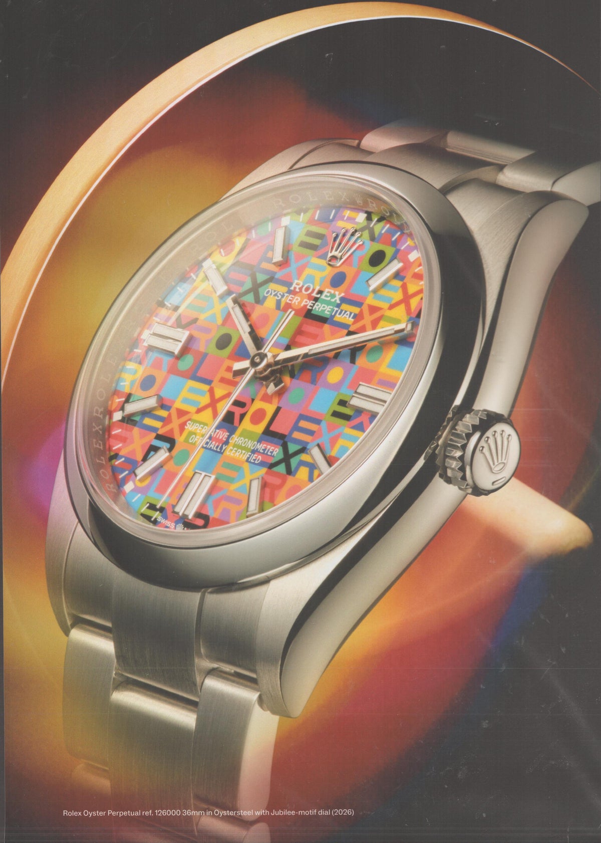Vintage 2026 Rolex Oyster Perpetual ref. 126000 original print advertisement, close-up of colorful Jubilee-motif dial on Oystersteel bracelet against warm swirling background