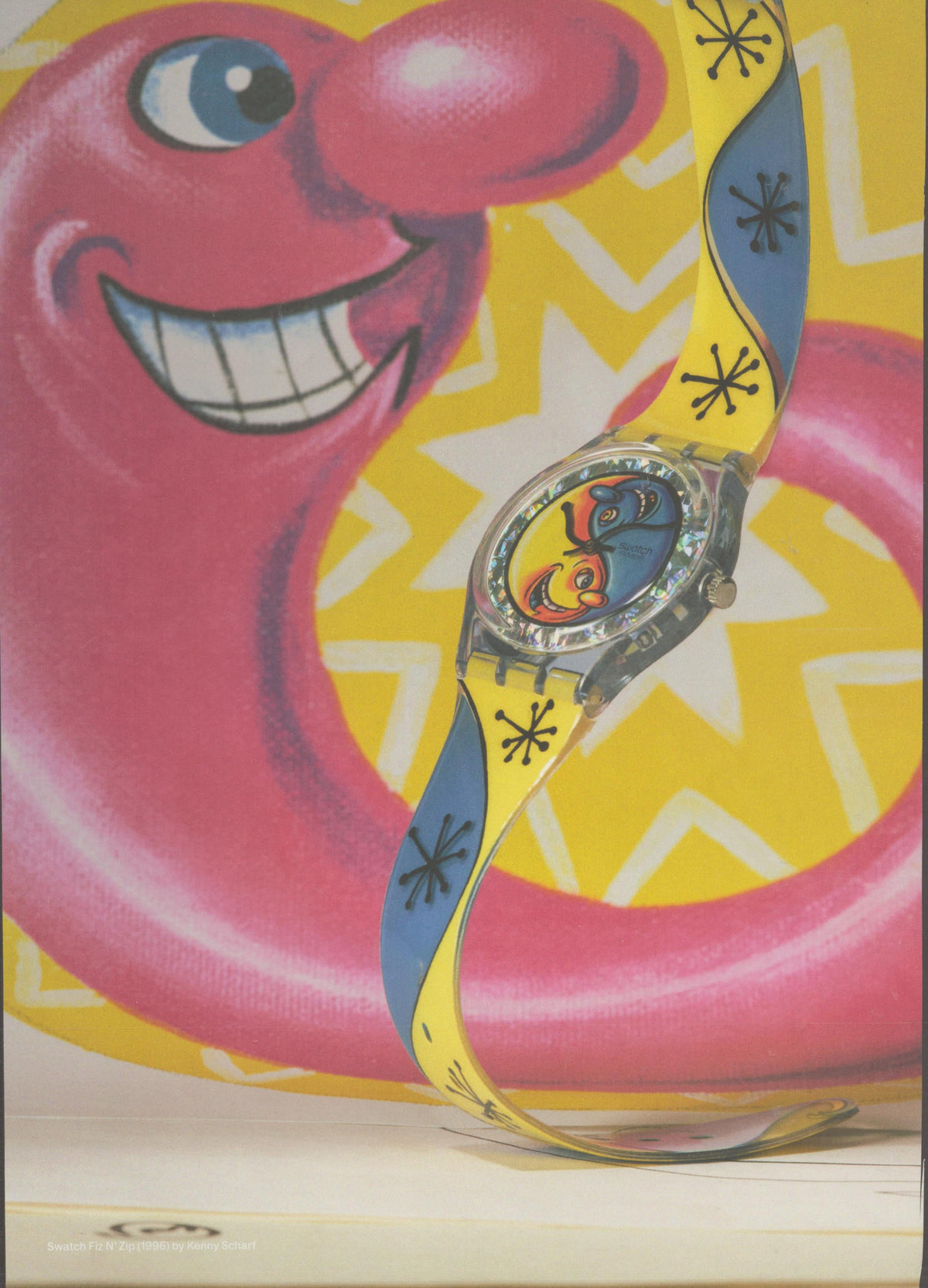 Vintage 1996 Swatch Fiz N' Zip original print advertisement, colorful artist-designed watch with yellow and blue strap displayed against a smiling pink inflatable pool ring on yellow chevron background