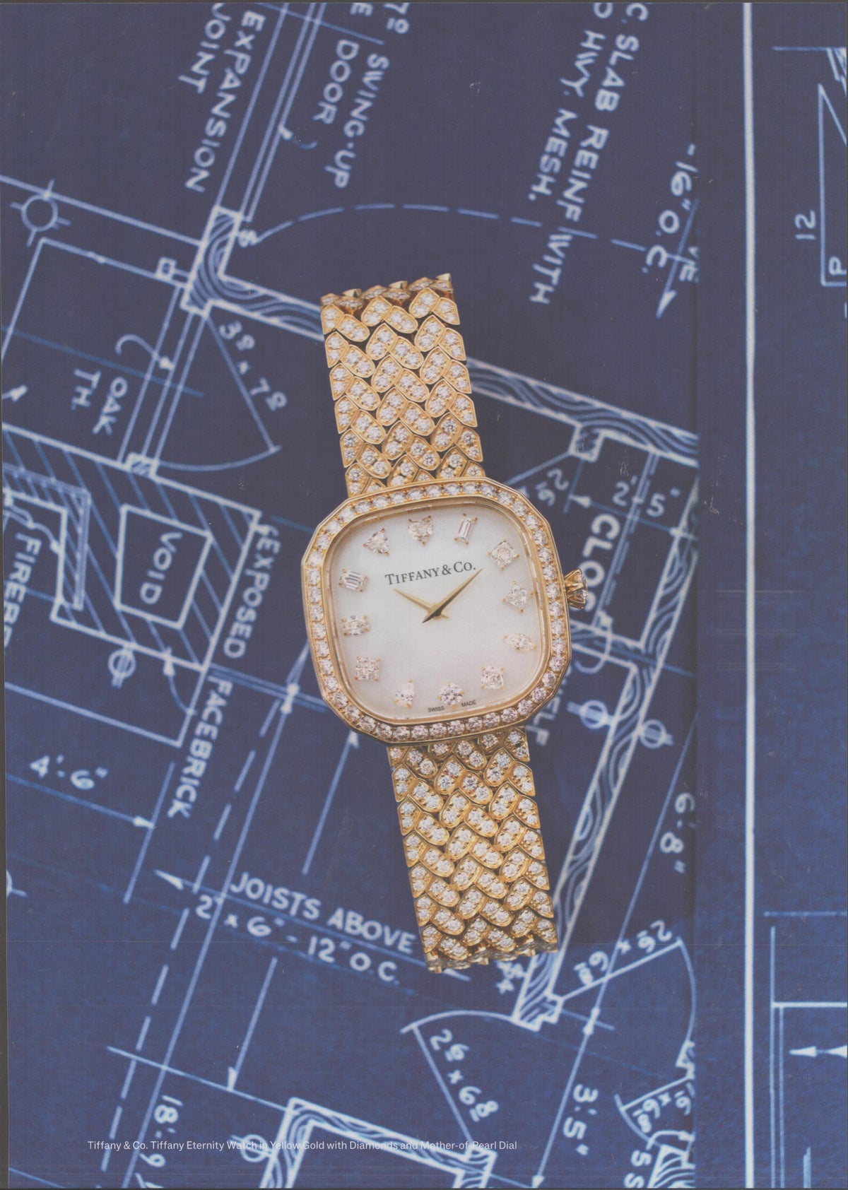 Vintage 1980s Tiffany & Co. Eternity Watch original print advertisement, yellow gold diamond-pavé bracelet watch laid across architectural blueprint drawings