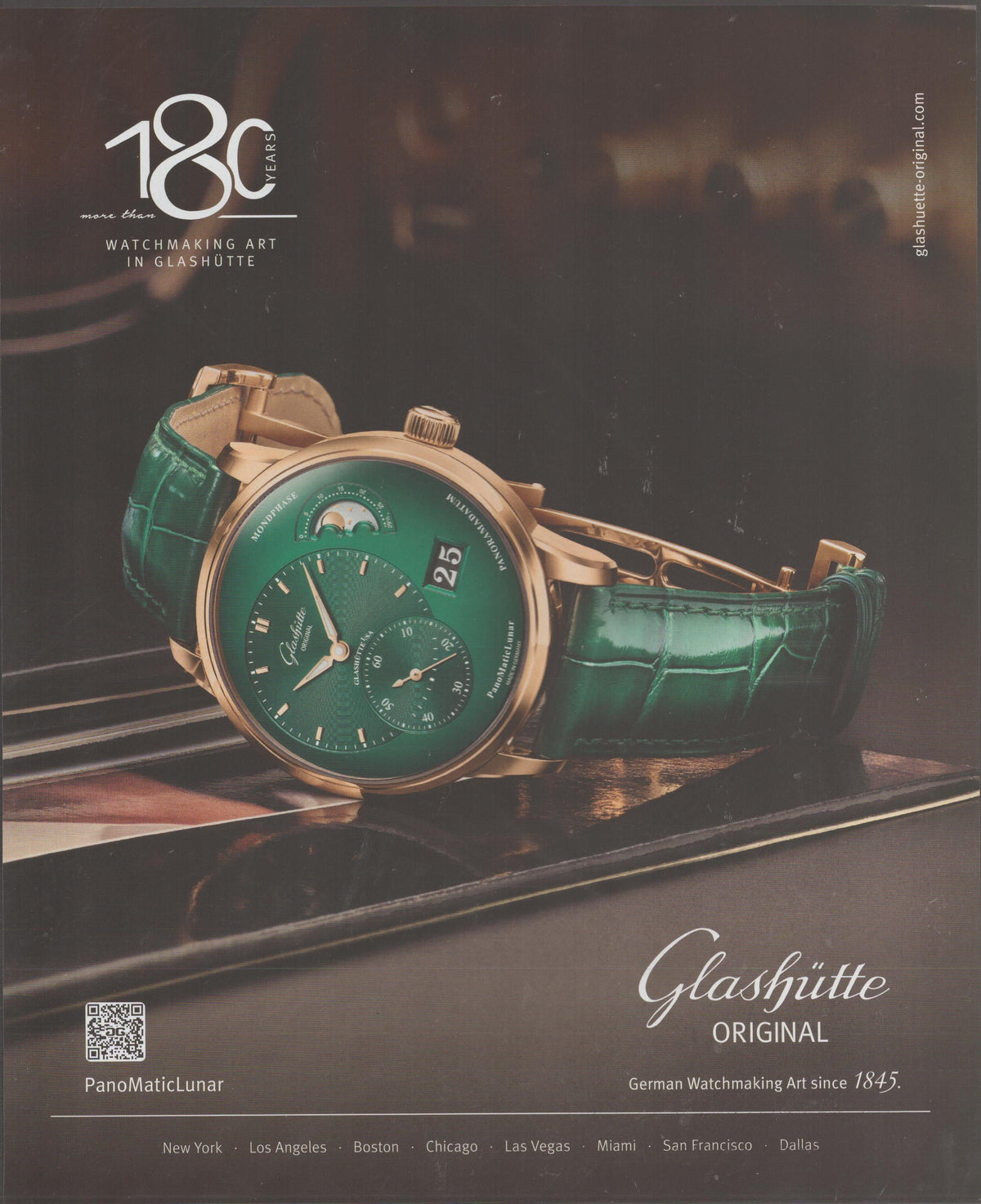 Vintage 2025 Glashütte Original PanoMaticLunar original print advertisement, rose gold watch with emerald green dial and matching alligator strap on dark piano surface