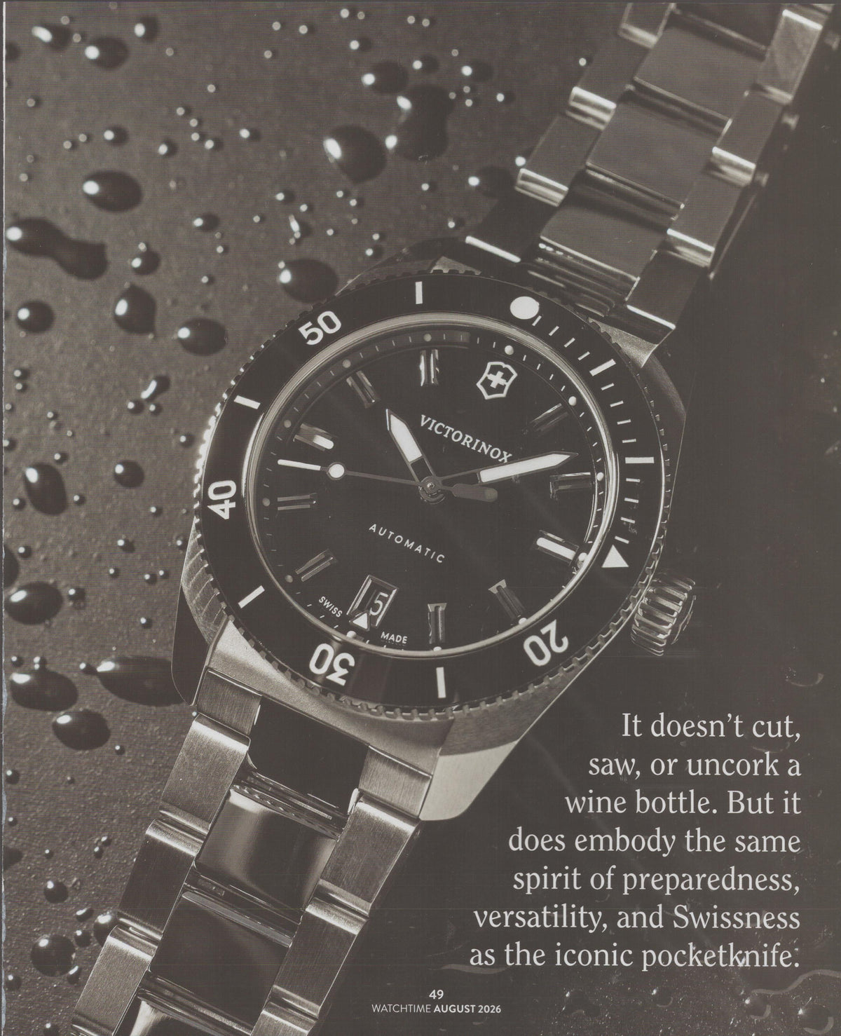 Vintage 2026 Victorinox Automatic Diver original print advertisement, black and white close-up of stainless steel dive watch on wet surface with water droplets
