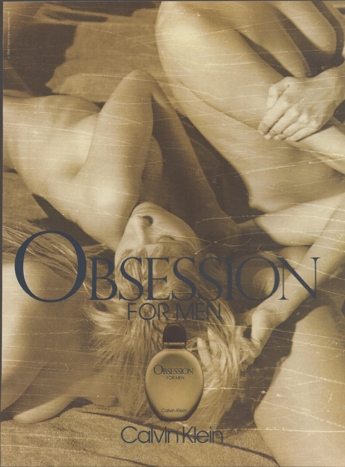 Vintage 1992 Calvin Klein Obsession for Men original print advertisement, sepia-toned image of intertwined figures with Obsession fragrance bottle