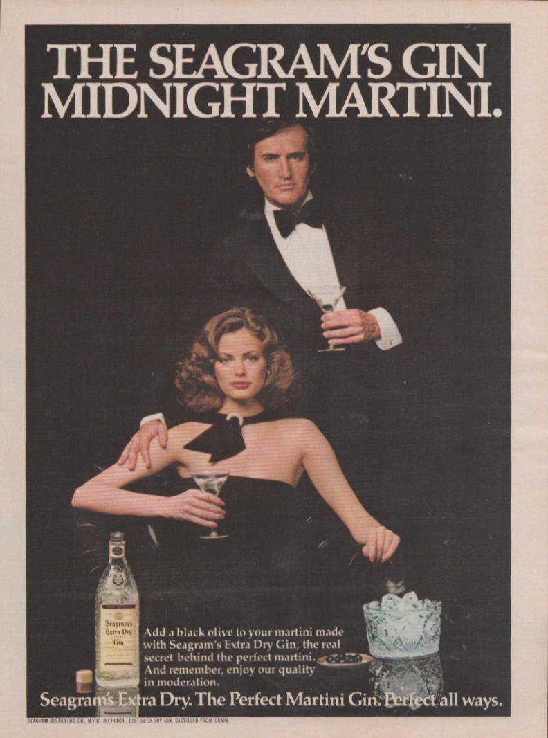 Vintage 1970s Seagram's Extra Dry Gin original print advertisement, elegant couple in black tie holding martini glasses against a dark background with gin bottle and ice bucket