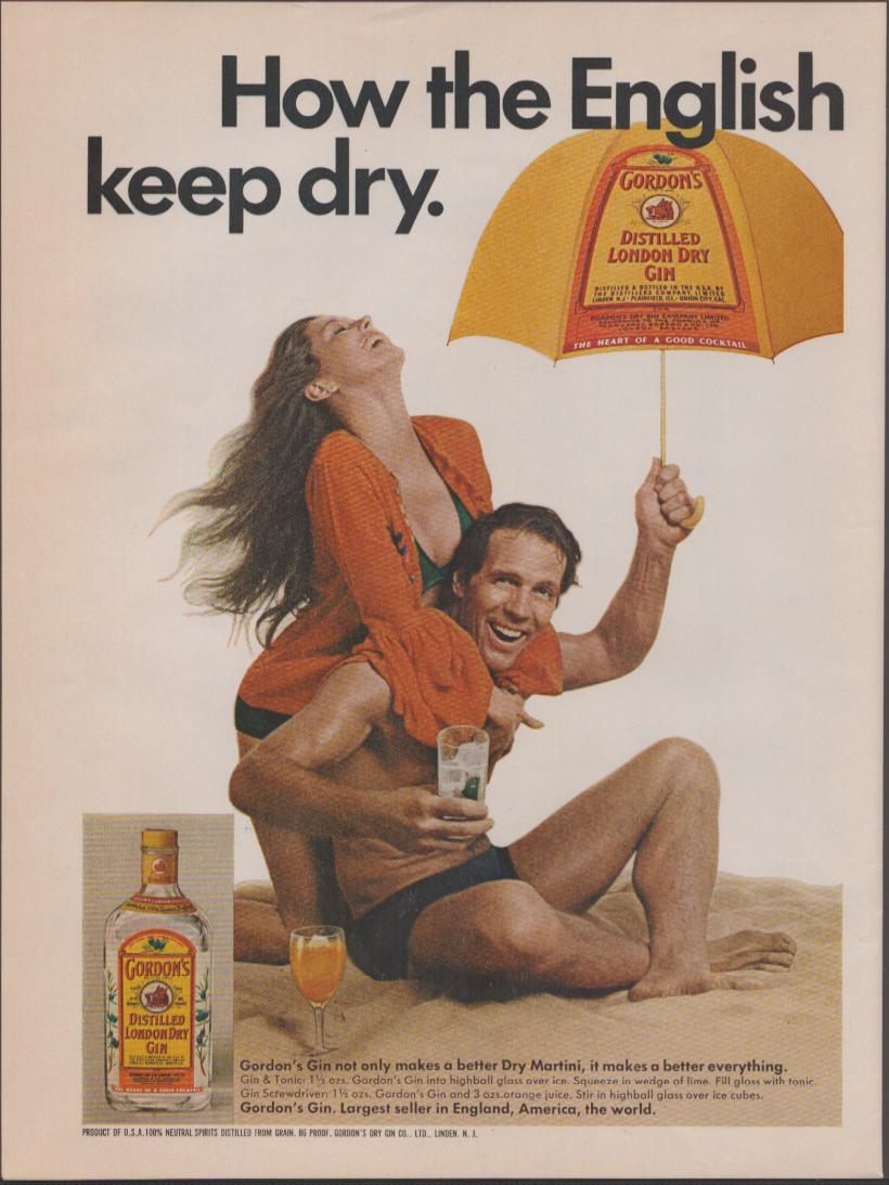 Vintage 1960s Gordon's Distilled London Dry Gin original print advertisement, laughing couple on beach with Gordon's branded yellow umbrella and bottle