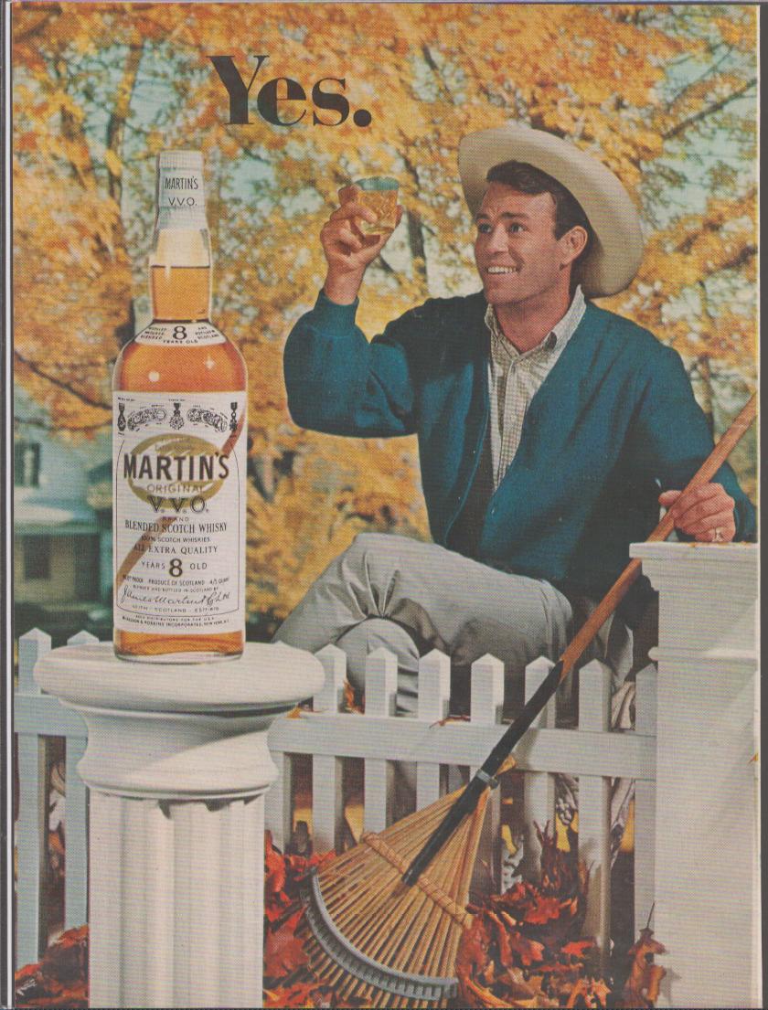 Vintage 1960s Martin's VVO Blended Scotch Whisky original print advertisement, smiling man in cowboy hat raising a glass beside a white picket fence with autumn leaves and a rake