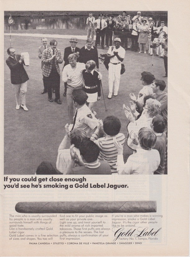 Vintage 1970s Gold Label Jaguar cigars original print advertisement, black and white photo showing crowded scene with celebrity endorsement theme