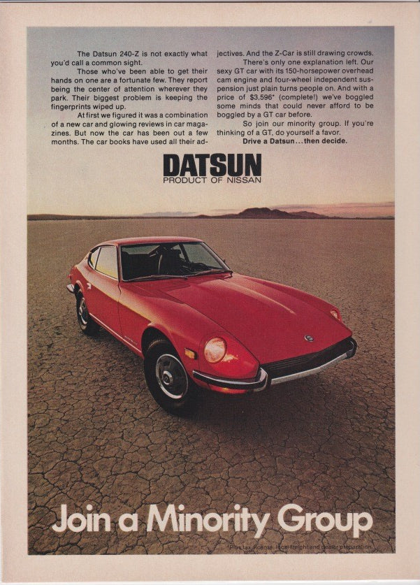 Vintage 1970s Datsun 240-Z original print advertisement, red sports car on cobblestone with 'Join a Minority Group' headline