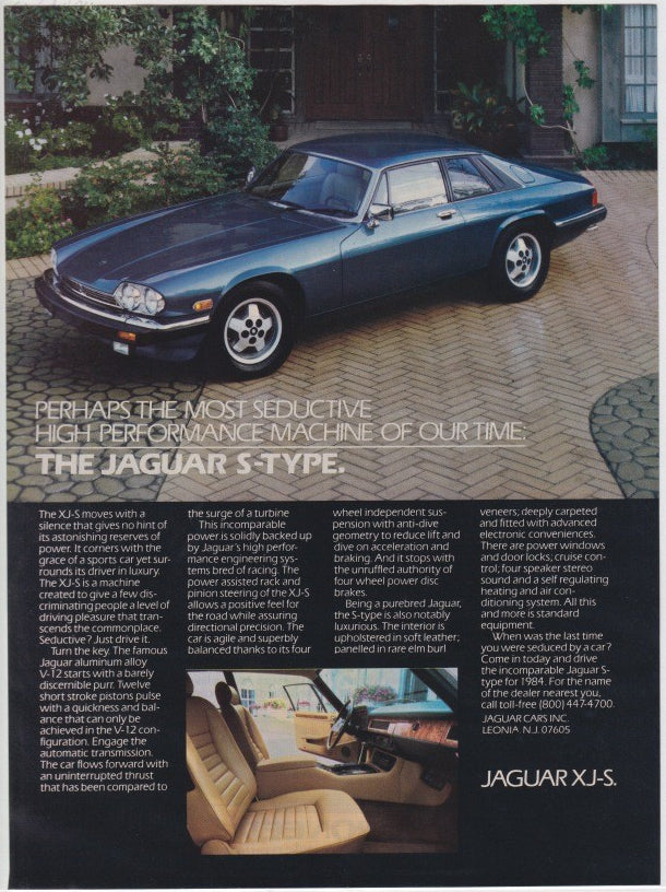Vintage 1984 Jaguar XJ-S original print advertisement, metallic blue coupe parked on cobblestone driveway with interior detail inset