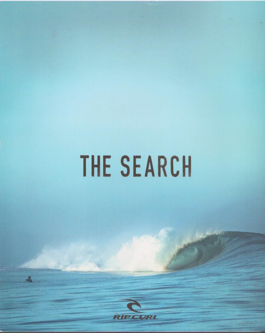 Vintage 1990s Rip Curl 'The Search' original print advertisement, lone surfer in the water facing a perfect hollow barrel wave under a pale blue sky