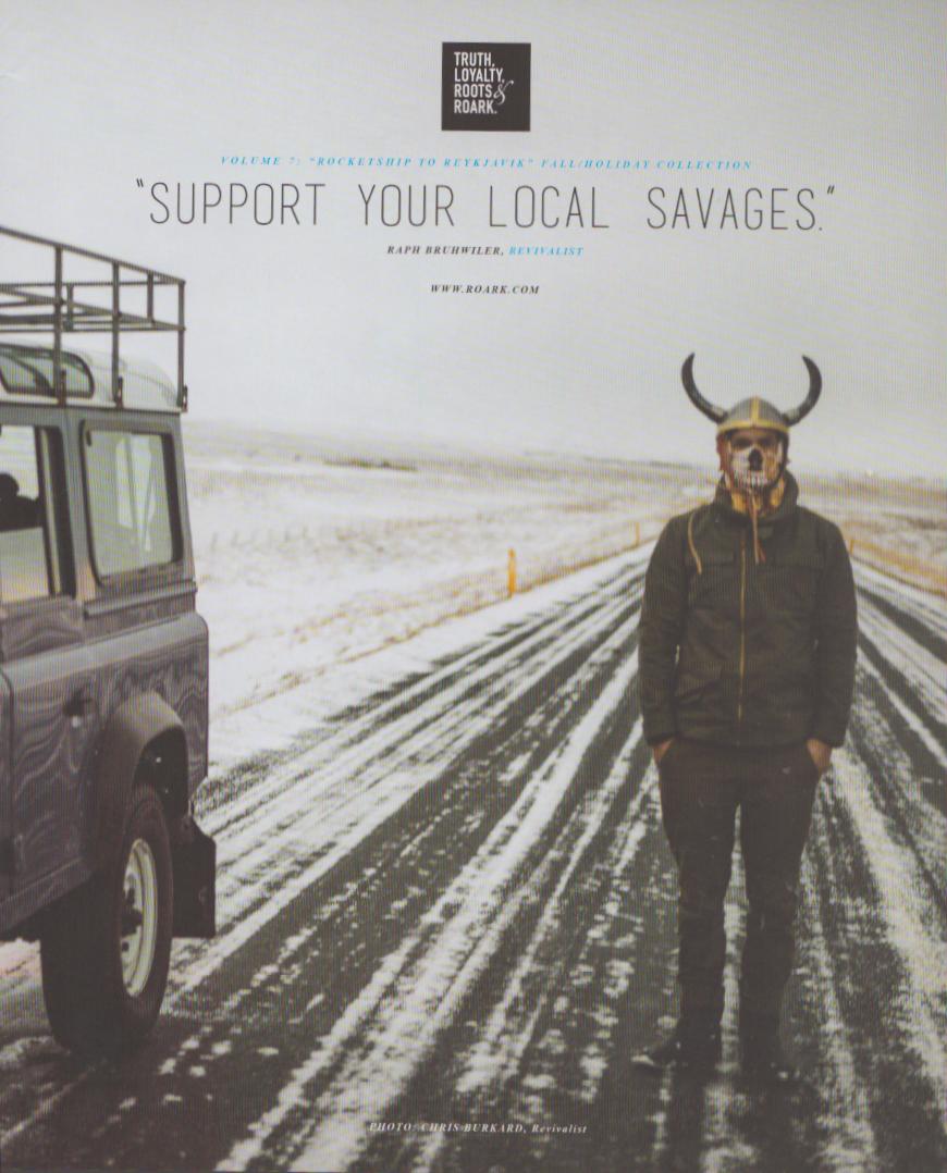 Vintage Roark Revival 'Rocketship to Reykjavik' original print advertisement, skull-masked figure in Viking horned helmet standing on snow-covered Icelandic highway beside a Land Rover Defender