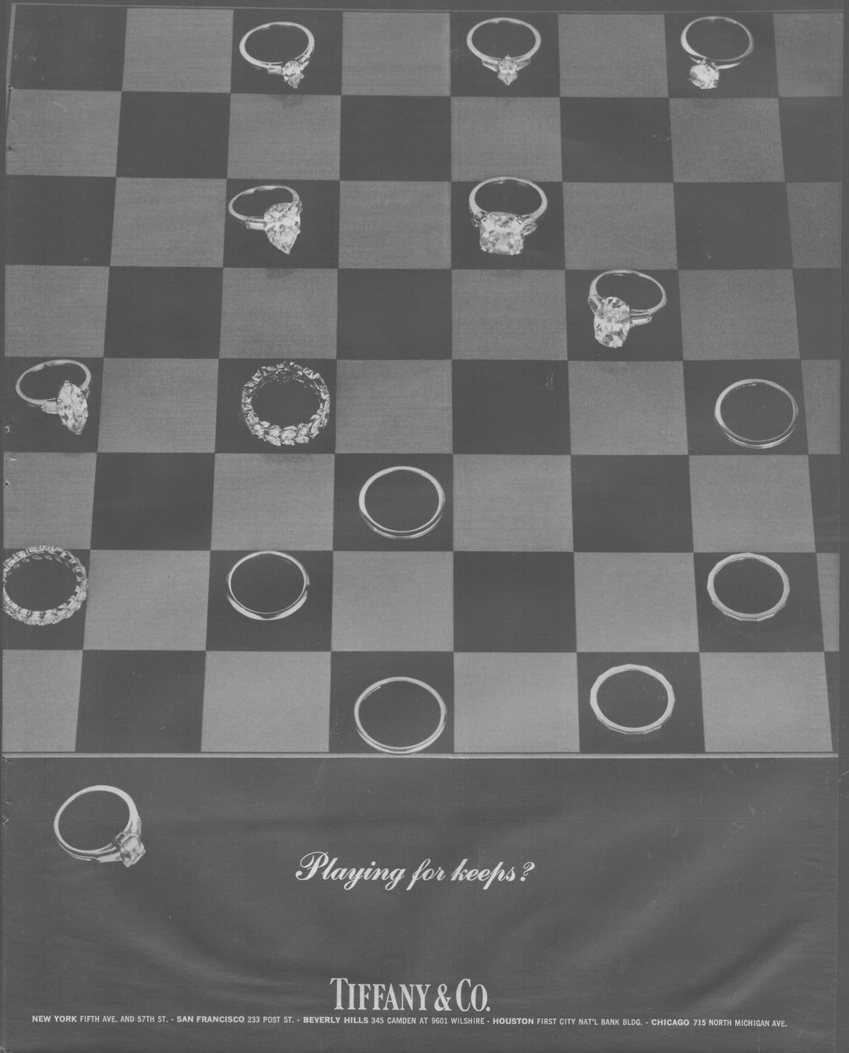 Vintage 1960s Tiffany & Co. original print advertisement, black and white checkerboard layout with diamond engagement rings and wedding bands as playing pieces, 'Playing for Keeps?' tagline