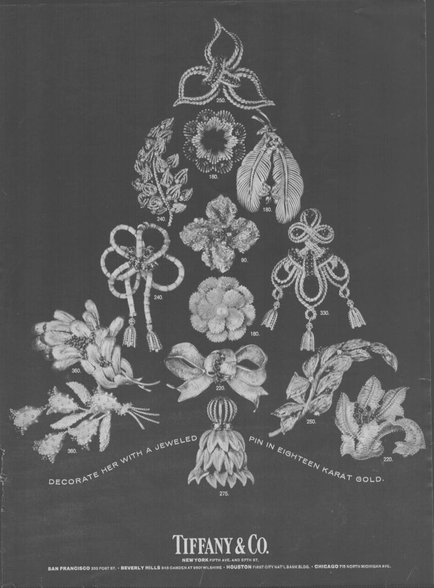 Vintage 1960s Tiffany & Co. original print advertisement, black and white image of eighteen karat gold jeweled pins arranged in a Christmas tree shape on dark background
