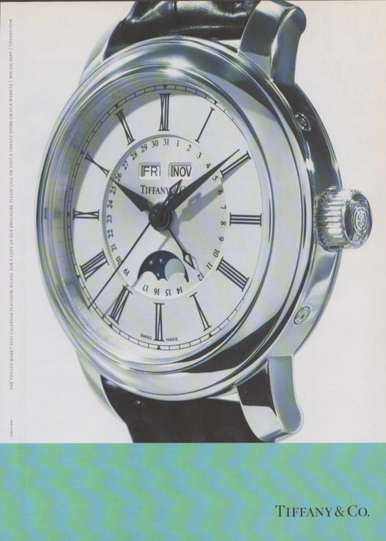 Vintage 2001 Tiffany & Co. Mark Full Calendar Platinum original print advertisement, close-up of platinum watch with moonphase and Roman numeral dial on white background with teal wave panel