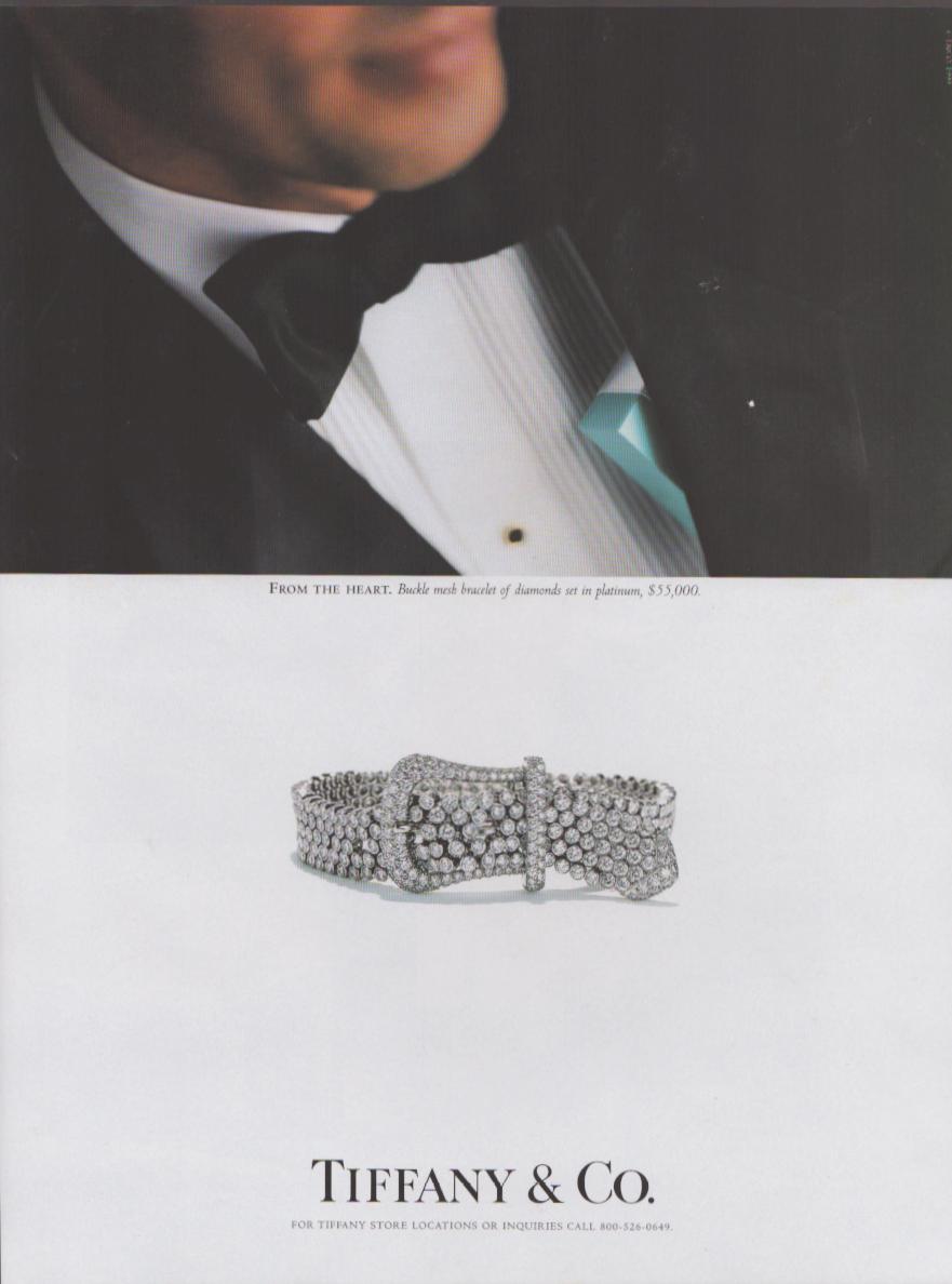 Vintage 1990s Tiffany & Co. diamond buckle bracelet original print advertisement, man in tuxedo holding Tiffany blue box with platinum diamond bracelet shown below
