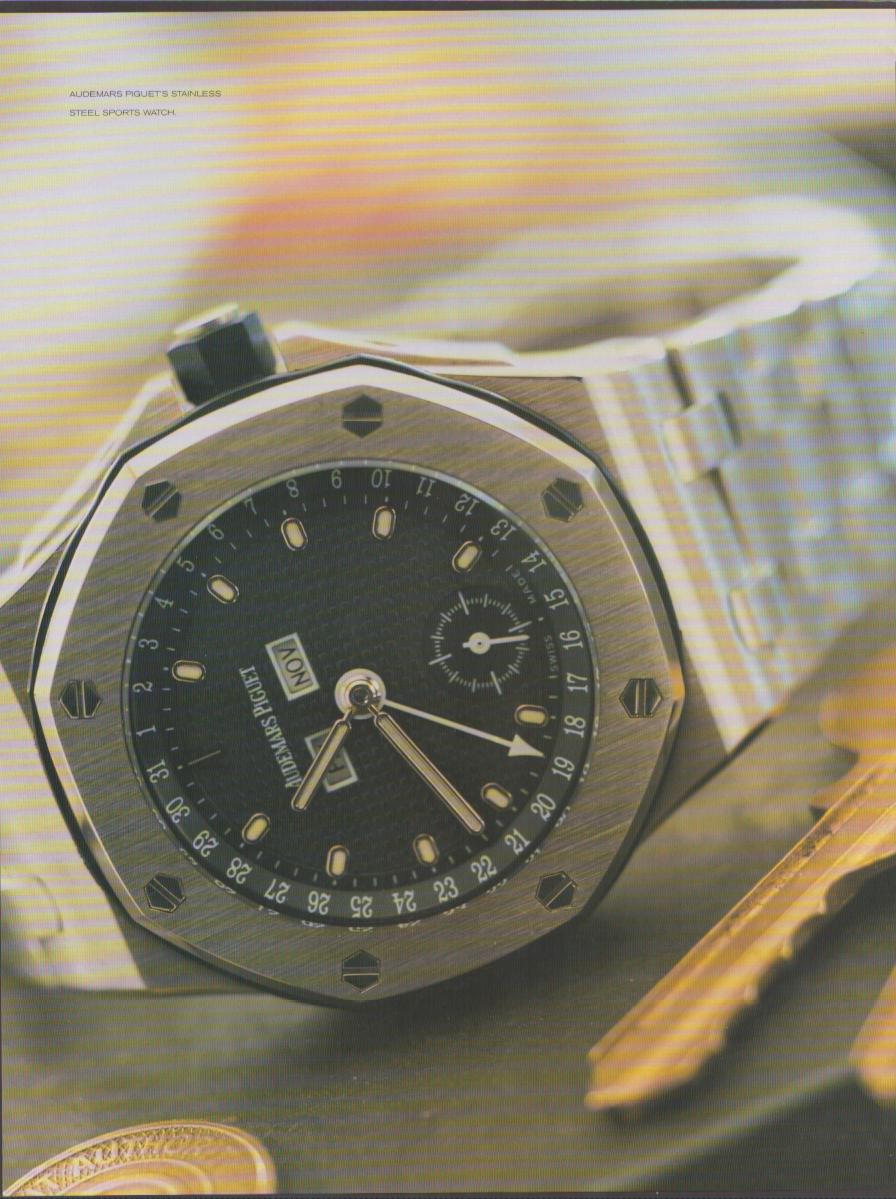 Vintage 1990s Audemars Piguet Royal Oak original print advertisement, dramatic close-up of octagonal stainless steel sports watch with black dial and calendar complication on integrated bracelet