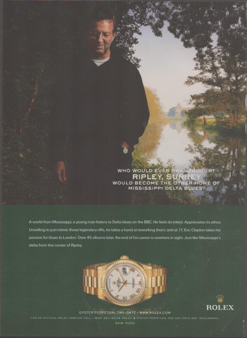 Vintage 2003 Rolex Day-Date original print advertisement featuring Eric Clapton standing in English countryside with gold President Day-Date watch displayed below