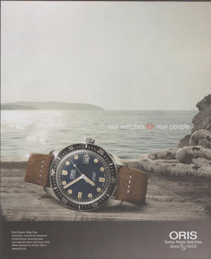 Vintage 2015 Oris Divers Sixty-Five original print advertisement, navy dial dive watch on tan leather strap resting on weathered dock with coastal ocean backdrop