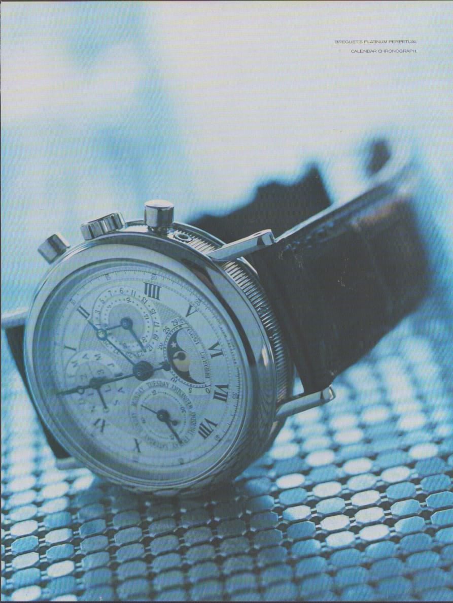 Vintage 1990s Breguet Platinum Perpetual Calendar Chronograph original print advertisement, dramatic close-up of intricate silver dial with moon phase, chronograph subdials, and Roman numerals on dark leather strap